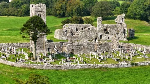 Slane Abbey, aerial drone view of old church with graveyard and monastery ruins. Ireland