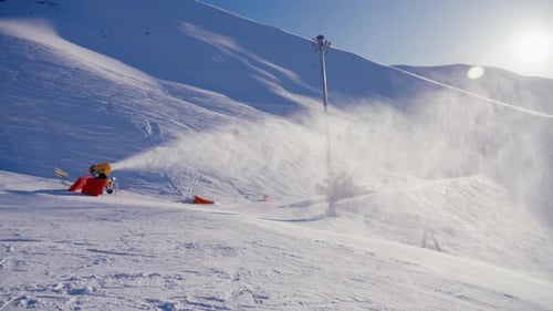 Snow Cannon at Ski Resort in Winter Snow Machine Produced Artificial Snow in Mountains on Slope at