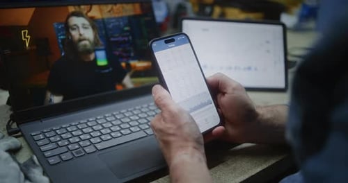 Worker Watching Online Trading Education on Laptop Monitoring Exchange Market Charts Using