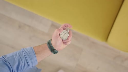 Top Down View Unrecognizable Man Raises His Hand with Chronometer in His Hand and Marks Time