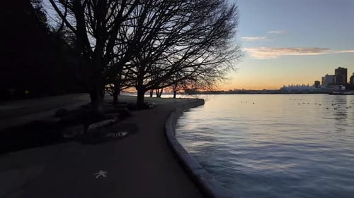 Scenic Seawall Path and Trees on Sunny Fall Morning Sunrise Stanley Park Downtown Vancouver