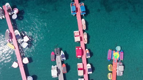 Aerial Footage over Deck Marina With Speed boats Top Down view