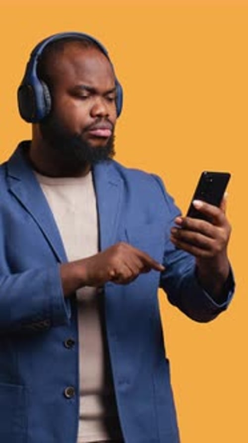 Vertical Video Relaxed Person Selecting Songs From Playlist Studio Background