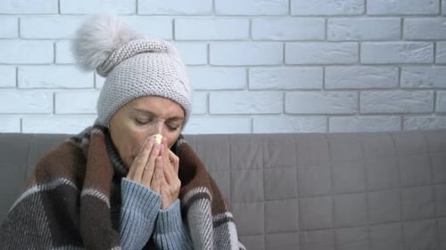 Female Feel Exhausted Sneezing in Flat