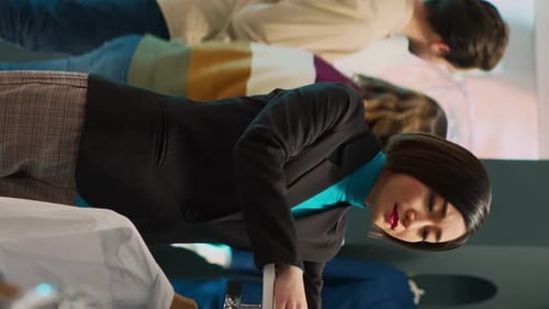 Vertical Video Asian Woman Shopping in Fashionable Clothing Store