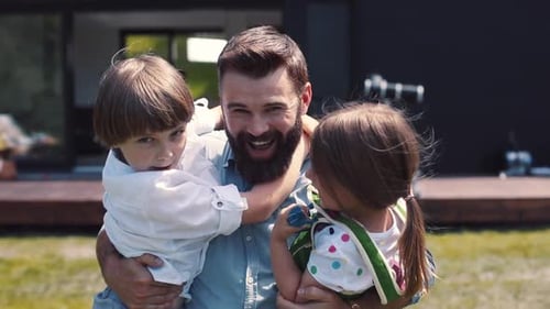 Nice Cheerful Caucasian Dad Holding Kids in Hands Father and Children Having Fun Waving Happy
