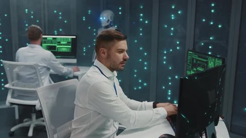 Data Center Modern IT Specialist Bearded Guy Programming Software Security Code and Cooperating with