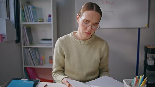 Serious Woman Checking Homework Class Room Closeup Tired Educator Taking Break