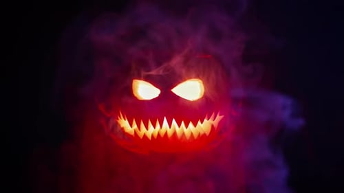 Horrible Steaming Pumpkin As Head of Jackolantern with Carved Eyes and Wicked Smirk