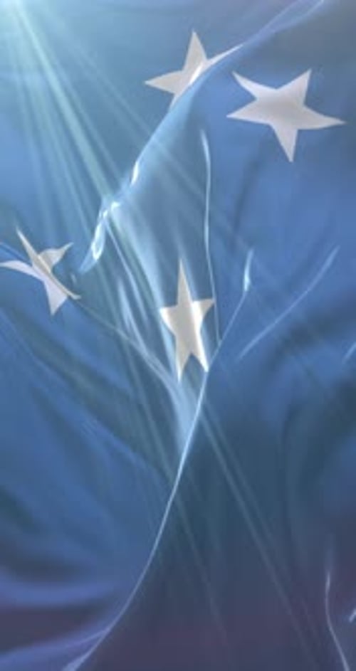 Waving Blue Flag with White Stars and Sun Rays