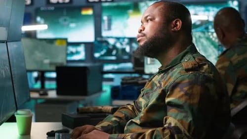 Soldiers Working with Computers in Command Center