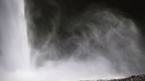 Stunning close up shot of the powerful Seljalandsfoss waterfall mist in Iceland.