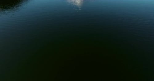 Lake Kawaguchiko Reveals Mount Fuji In Japan. Aerial Tilt-up Shot
