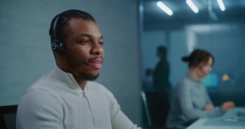 Close Up of African American Technical Support Specialist in Headset Consulting Client on Call
