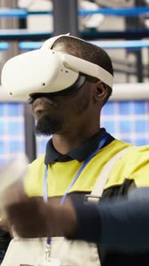 Vertical Video Engineer in Smart Factory Does Maintenance Using VR Headset Tech