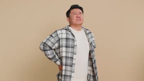 Man Experiencing Lower Back Pain and Discomfort