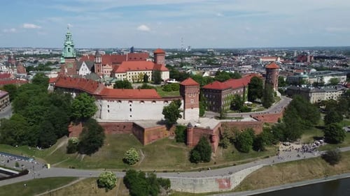 Flyover of the Wawel Royal Castle Cathedral on the Vistula (Wisła) River - Krakow, Poland, a Polish