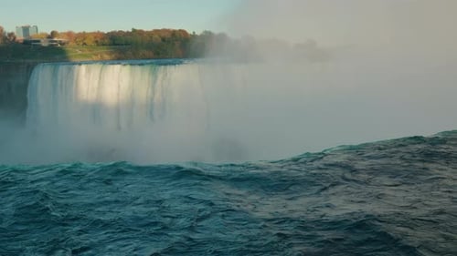 Niagara Falls Waterfall with Powerful River Current and Dense Mist Rising Above Dramatic Natural