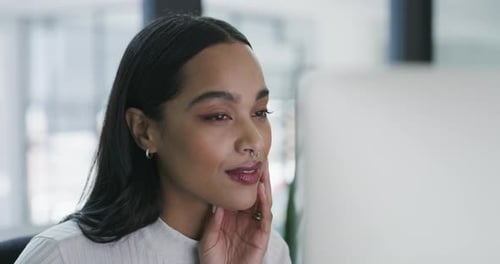 4k video footage of a young businesswoman working in an office