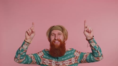 Hippie Man Showing Thumbs Up and Pointing Empty Place Advertising Area for Commercial Text Promotion