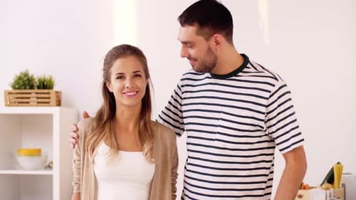 Loving Couple Embracing in Bright Kitchen Setting