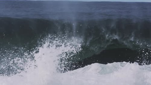 Powerful Ocean Wave Crashing with Spraying Foam