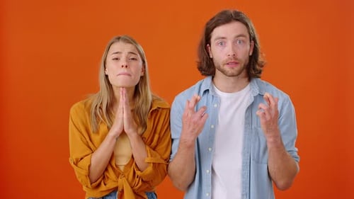 Hopeful Woman and Man Making a Wish