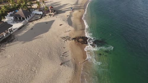 Emerald waters meet golden sands at Chahue Beach in Huatulco, Oaxaca, Mexico