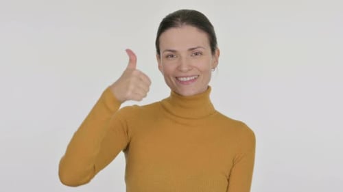 Smiling Woman Gives Thumbs Up on White Background