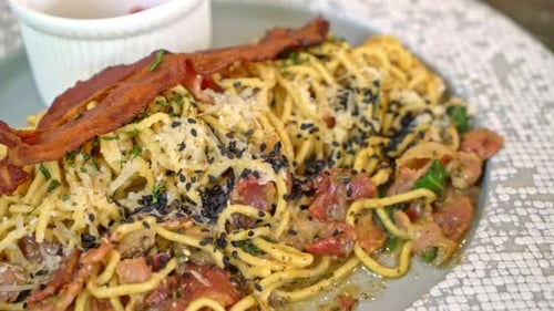 Delicious Plate of Pasta with Bacon and Cheese