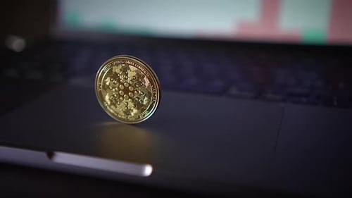 Gold Crypto Coin on Computer Close Up