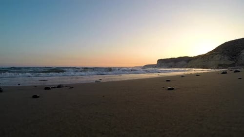 Slow Motion View of Sunset Over the Sea, Calm Sea Waves Washing Sandy Beach