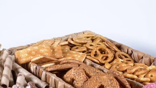 Assorted Sweet and Salty Treats in Wicker Basket