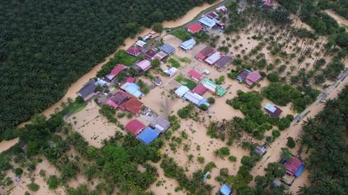 A flooded area with houses and trees. Aerial view flood Junjung, Kedah