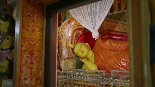 Reclining Buddha Statue Inside Ornate Temple with Colorful Murals Sacred Buddhist Imagery Adorns