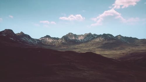 A Majestic Mountain Range with Scenic Clouds in the Sky