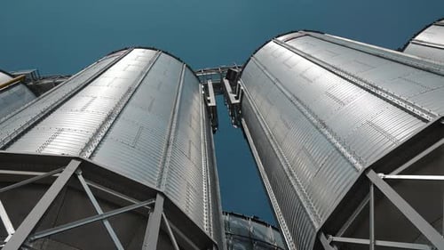 Closeup View of Modern Grain Silos From Below A Striking Lowangle Shot of Modern Grain Silos