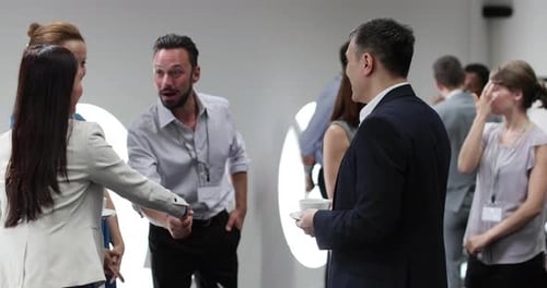 Business executives shaking hands at a networking event