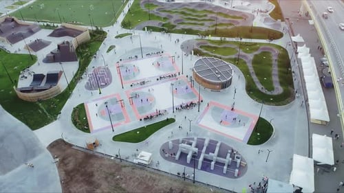 Basketball Playgrounds with Players in Park on Summer Day