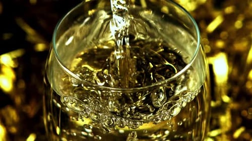 Liquid Being Poured into Glass Creates Bubbles