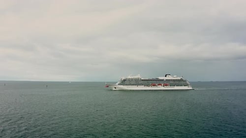 A Cinematic Drone Shot of a Cruise Ship Leaving the Port