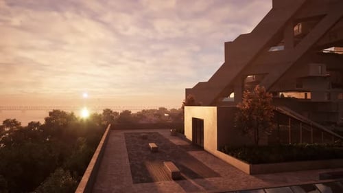 Una hermosa puesta de sol sobre un edificio frente al mar