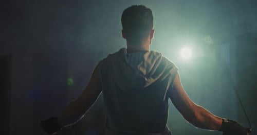 Active Man Jumping Skipping Rope in Sport Club