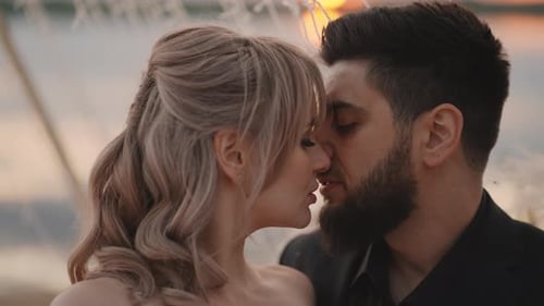 Kiss And Embrace Of Multiethnic Loving Couple Romantic Date Or Wedding On Beach In Sunset