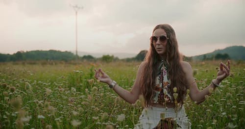 Stylish Woman Posing in a Flower Meadow