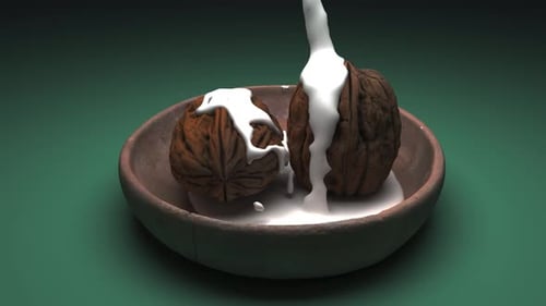 Milk Pours Over Walnuts in a Rustic Bowl