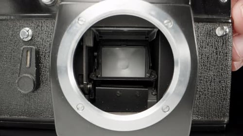 checking the work of an old film camera, close-up