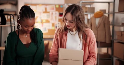 Women Preparing Packages in Office Workplace Setting