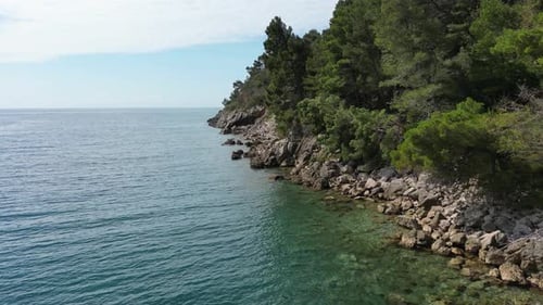 The drone flies over the sea. Beautiful clear water of the Adriatic Sea off the coast of Croatia.