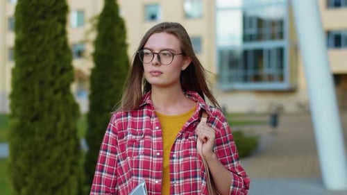 Smart Student Successful Young Woman Wearing Glasses and Bag Looking at Camera Standing on Street